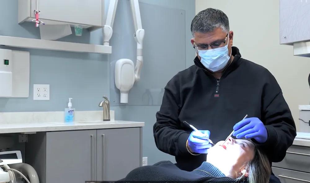Dr. Raj Mahal performing pediatric dental exam and gentle teeth cleaning at Just 4 Kidz Dental