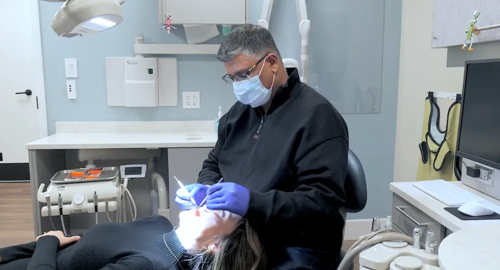 Dr. Raj Mahal performing gentle pediatric dental filling and restoration treatment at Just 4 Kidz Dental